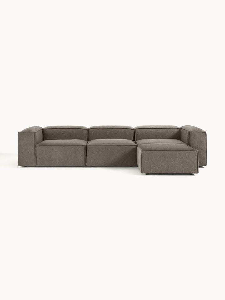 Canapé modulable 4 places en tissu bouclé avec pouf Frida