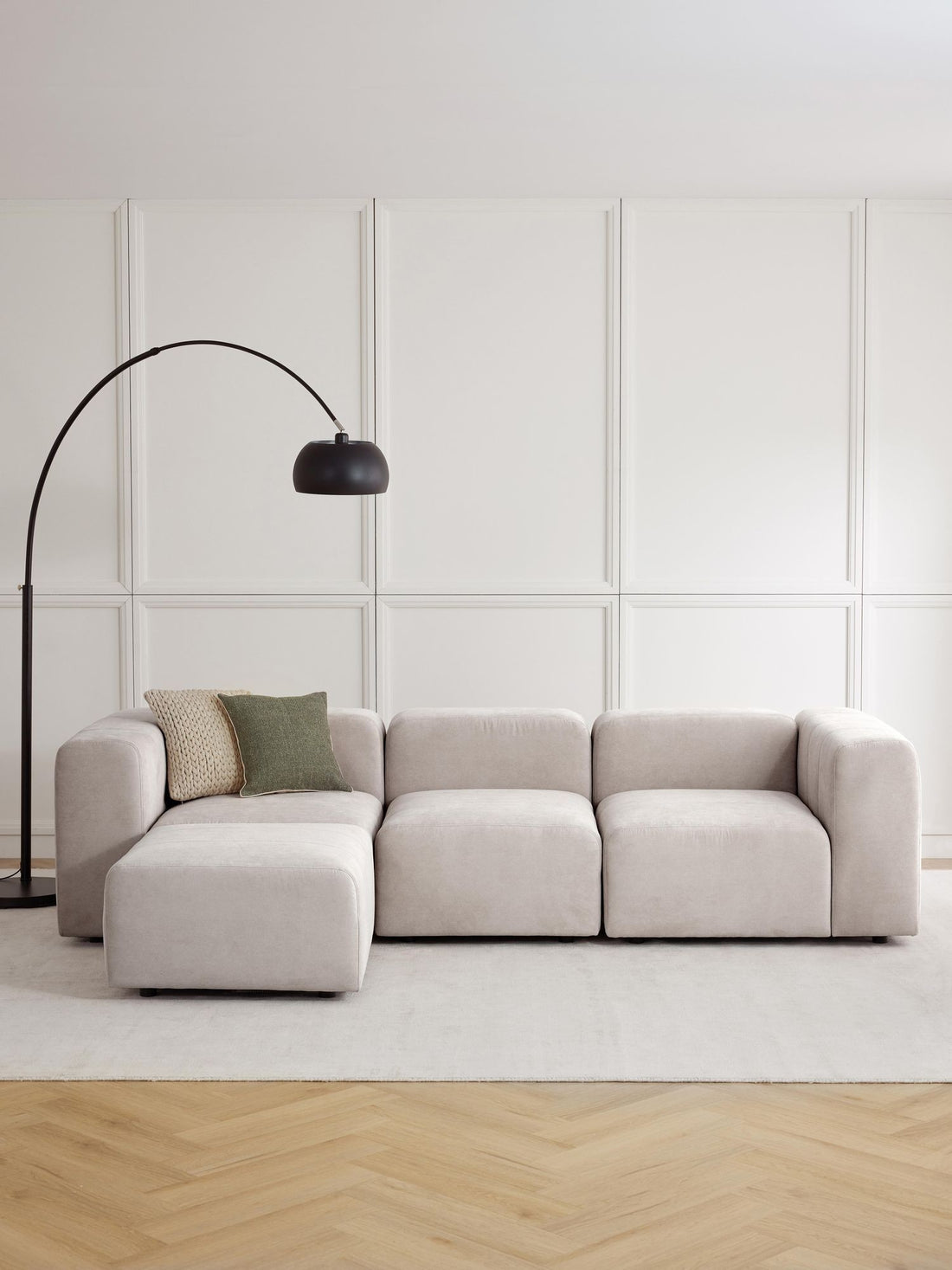 Canapé modulable 4 places en tissu avec pouf Pietro