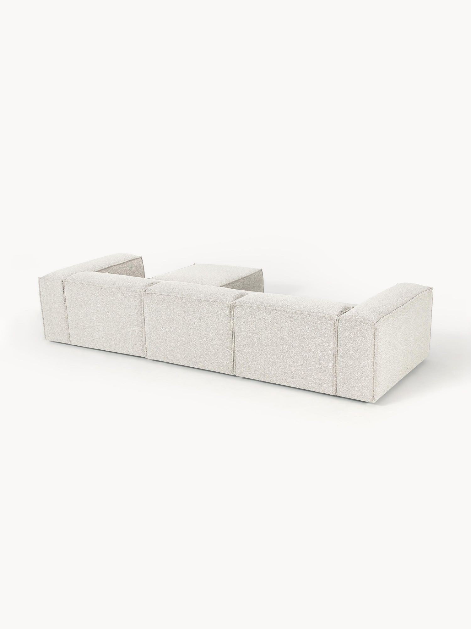 Canapé modulable 4 places en tissu bouclé avec pouf Frida