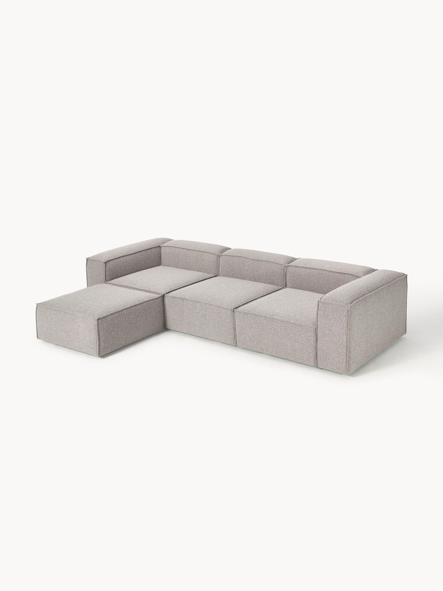 Canapé modulable 4 places en tissu bouclé avec pouf Frida