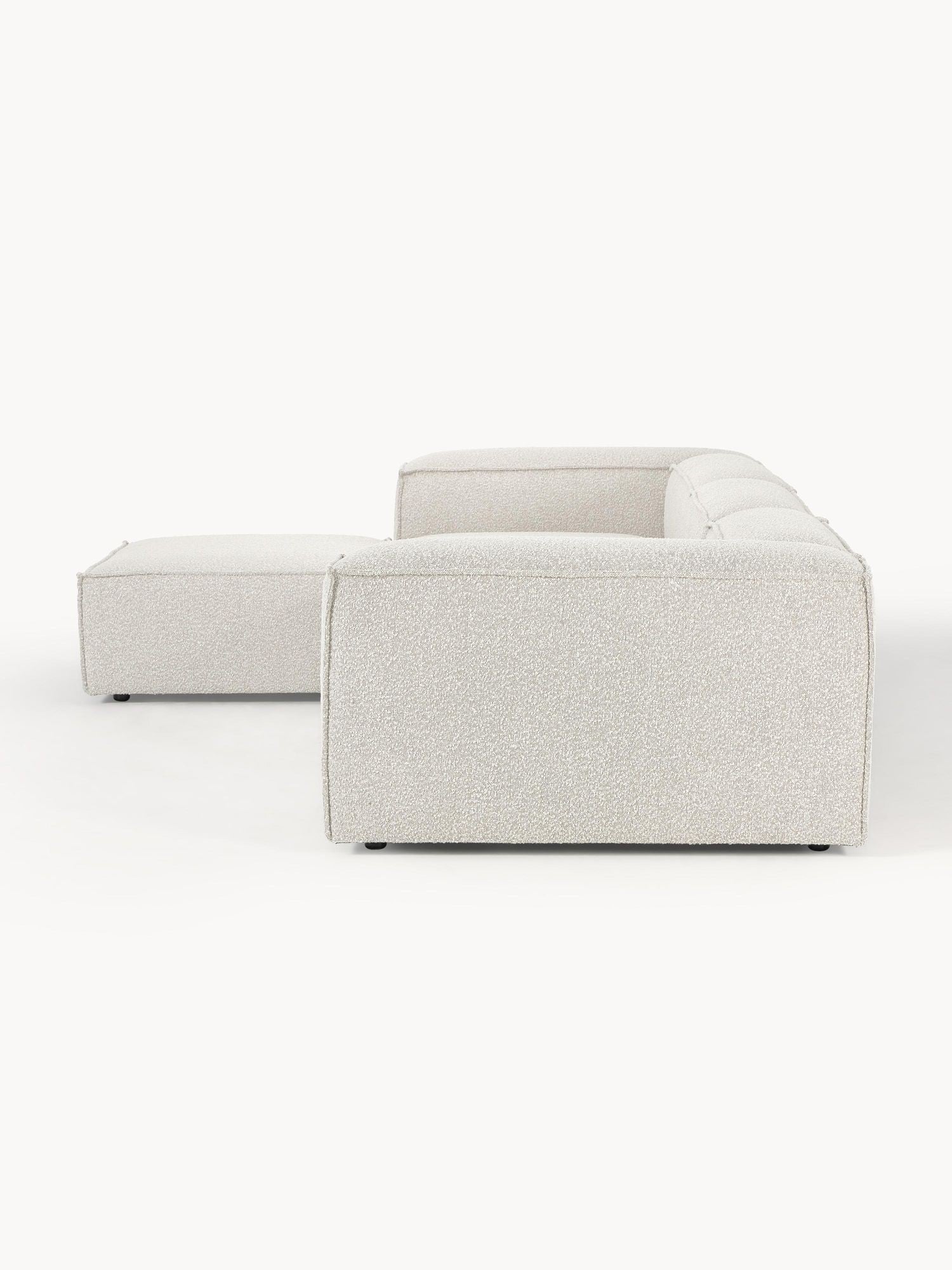 Canapé modulable 4 places en tissu bouclé avec pouf Frida