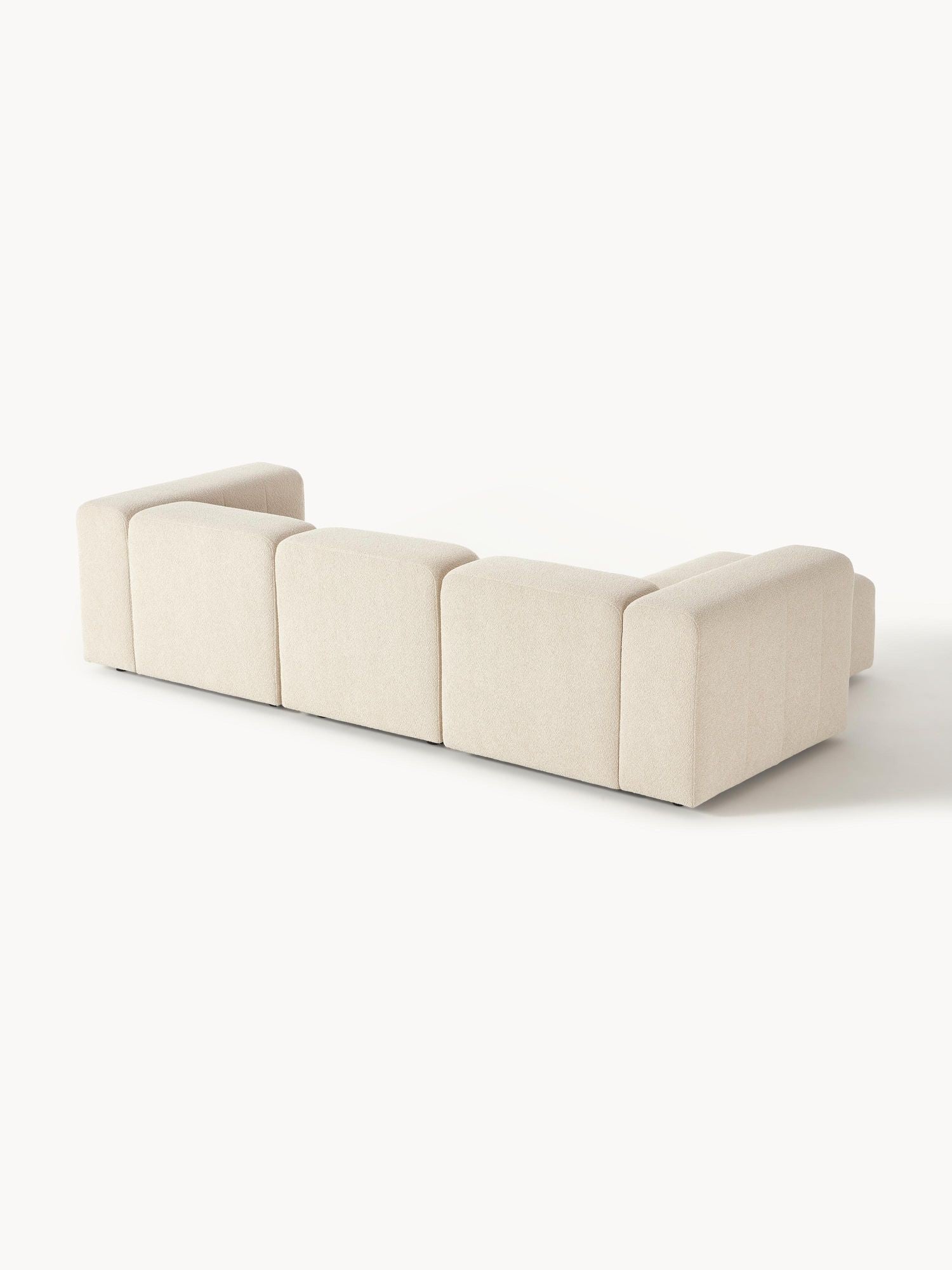 Canapé modulable 4 places en tissu bouclé avec pouf Pietro