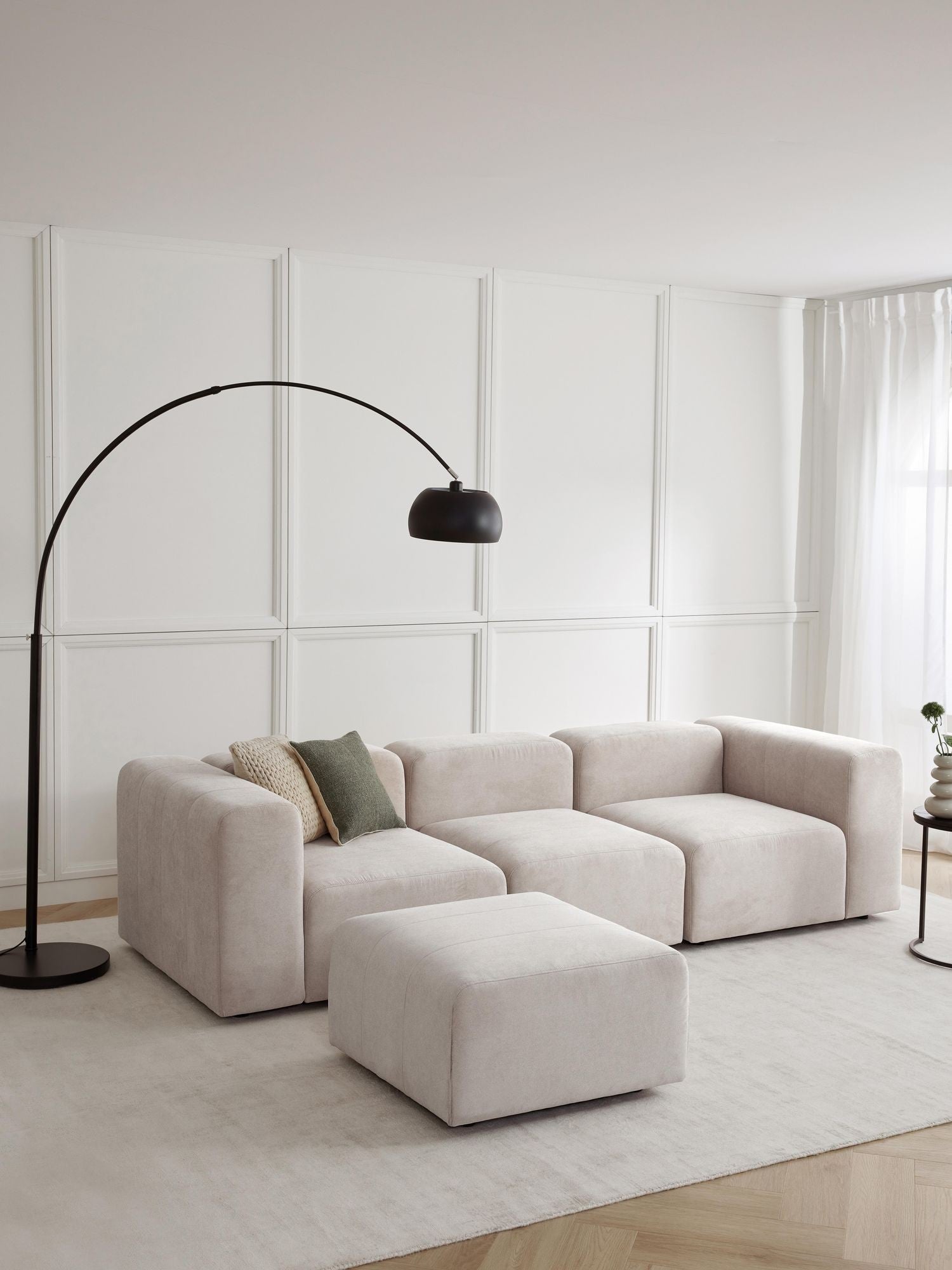 Canapé modulable 4 places en tissu avec pouf Pietro