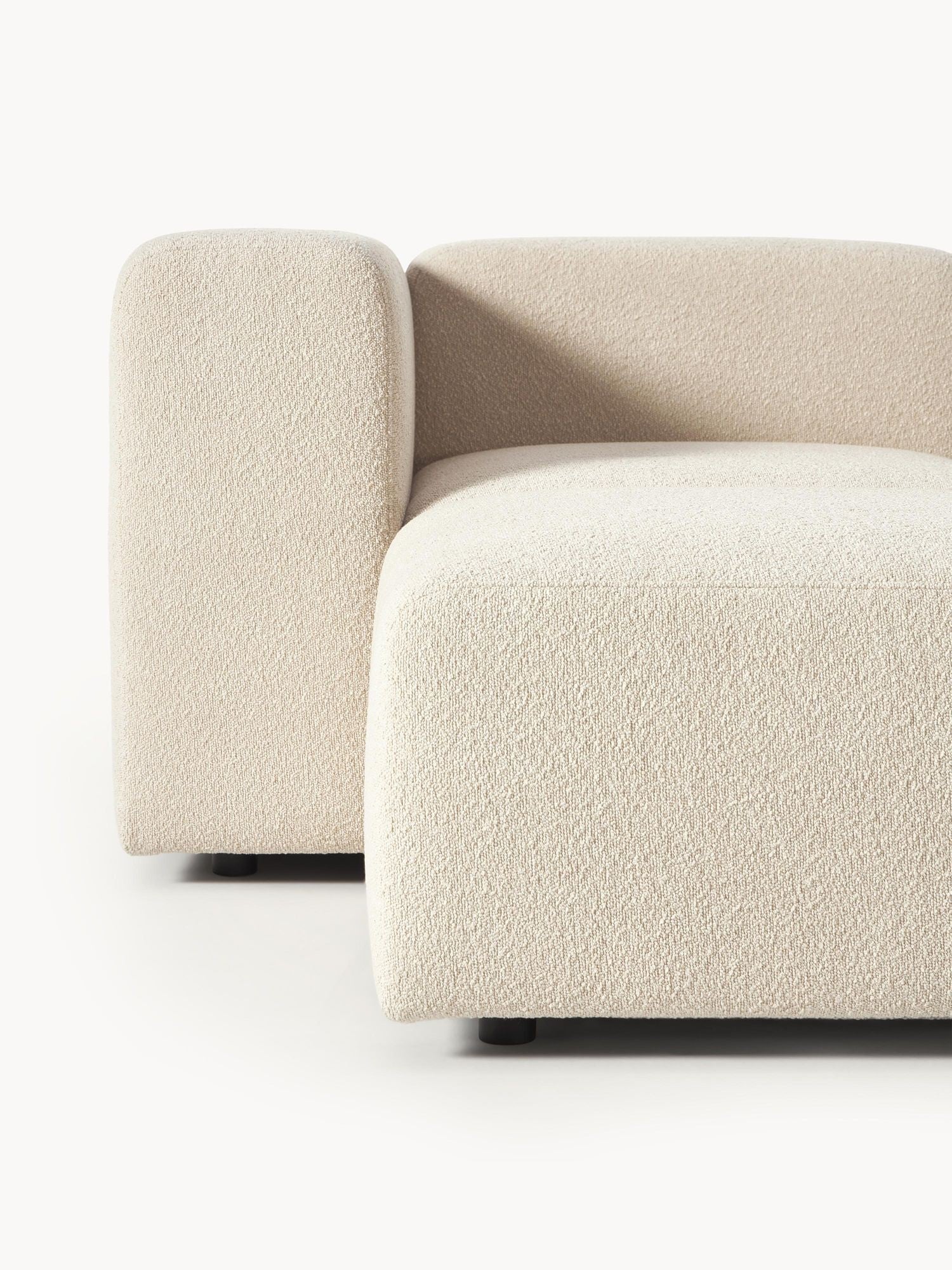 Canapé modulable 4 places en tissu bouclé avec pouf Pietro