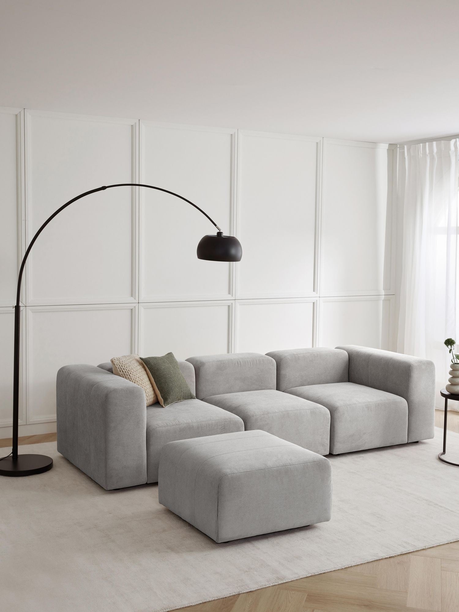 Canapé modulable 4 places en tissu avec pouf Pietro