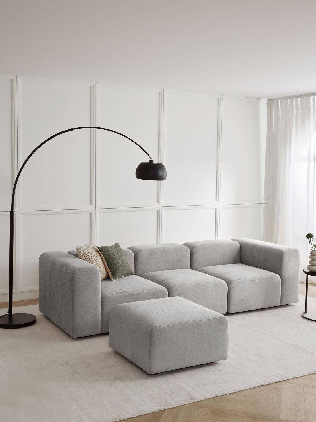 Canapé modulable 4 places en tissu avec pouf Pietro