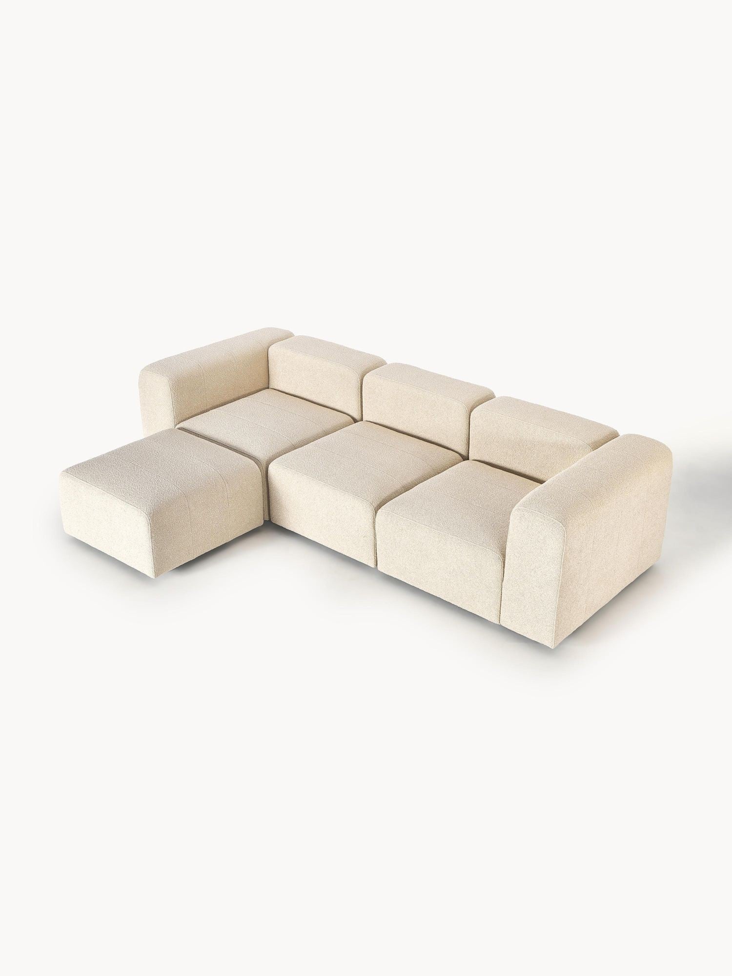 Canapé modulable 4 places en tissu bouclé avec pouf Pietro