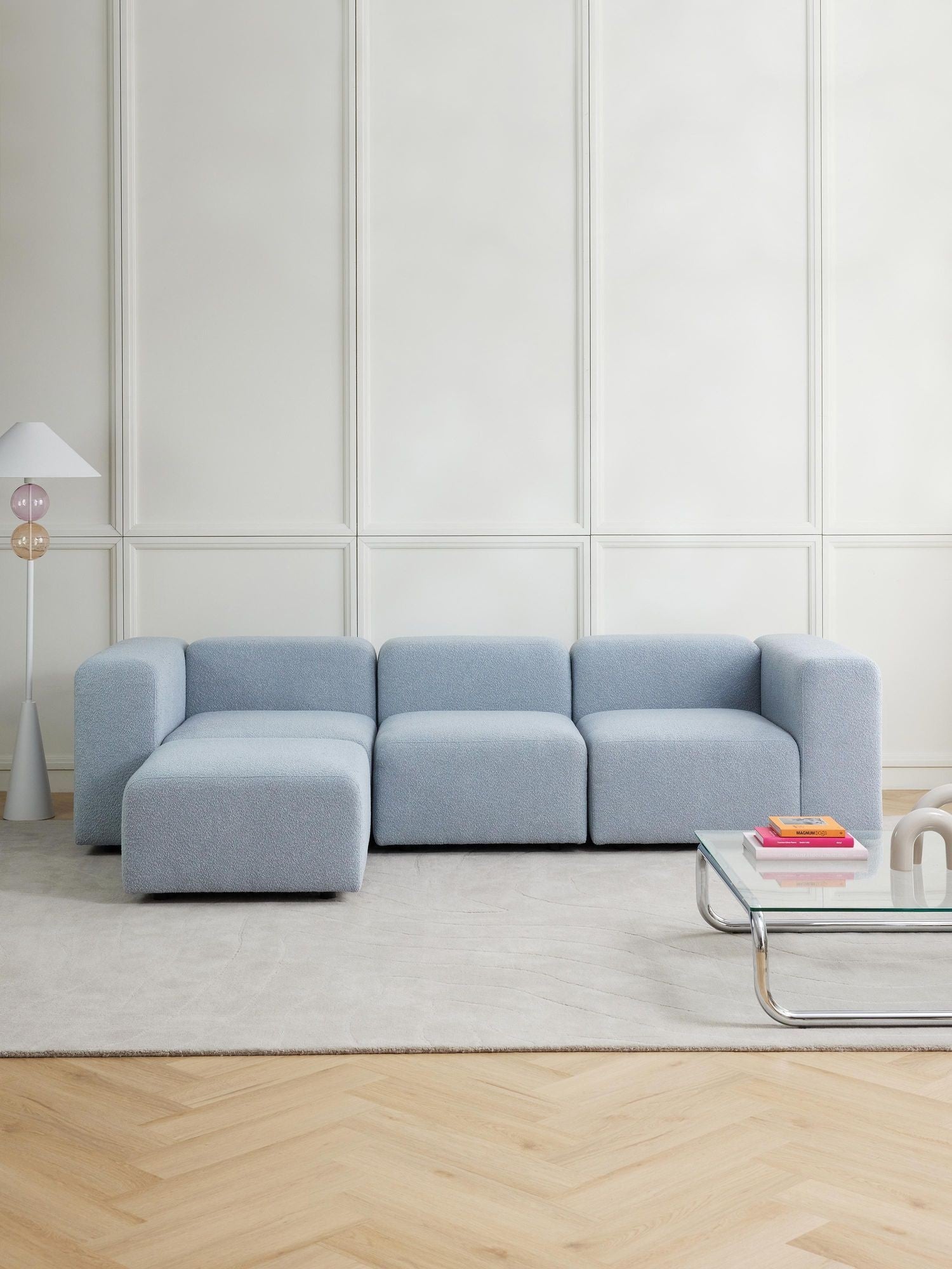 Canapé modulable 4 places en tissu bouclé avec pouf Pietro