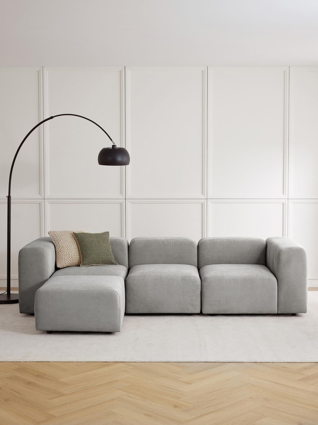 Canapé modulable 4 places en tissu avec pouf Pietro