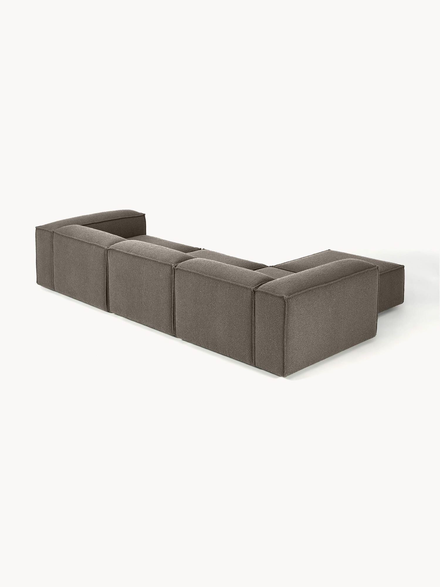 Canapé modulable 4 places en tissu bouclé avec pouf Frida