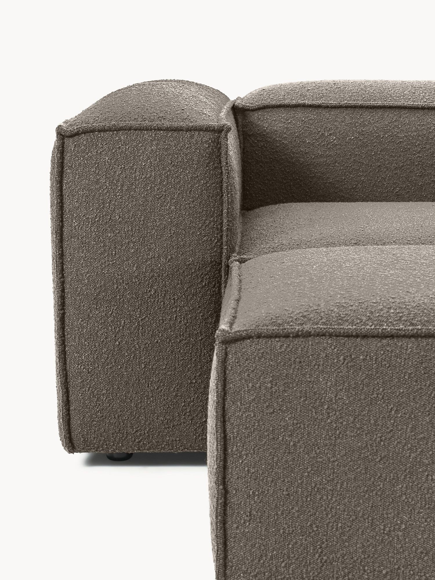 Canapé modulable 4 places en tissu bouclé avec pouf Frida