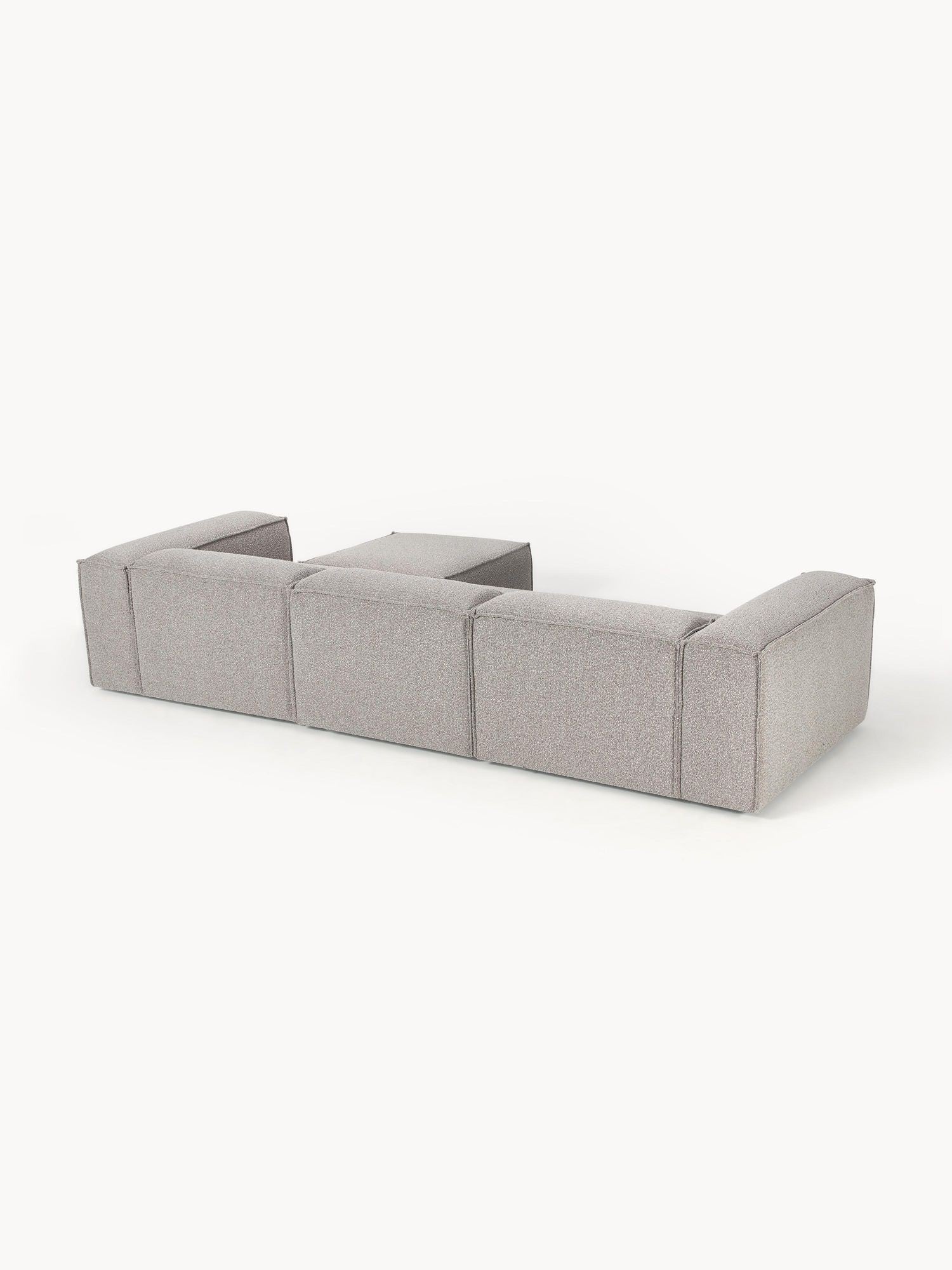 Canapé modulable 4 places en tissu bouclé avec pouf Frida