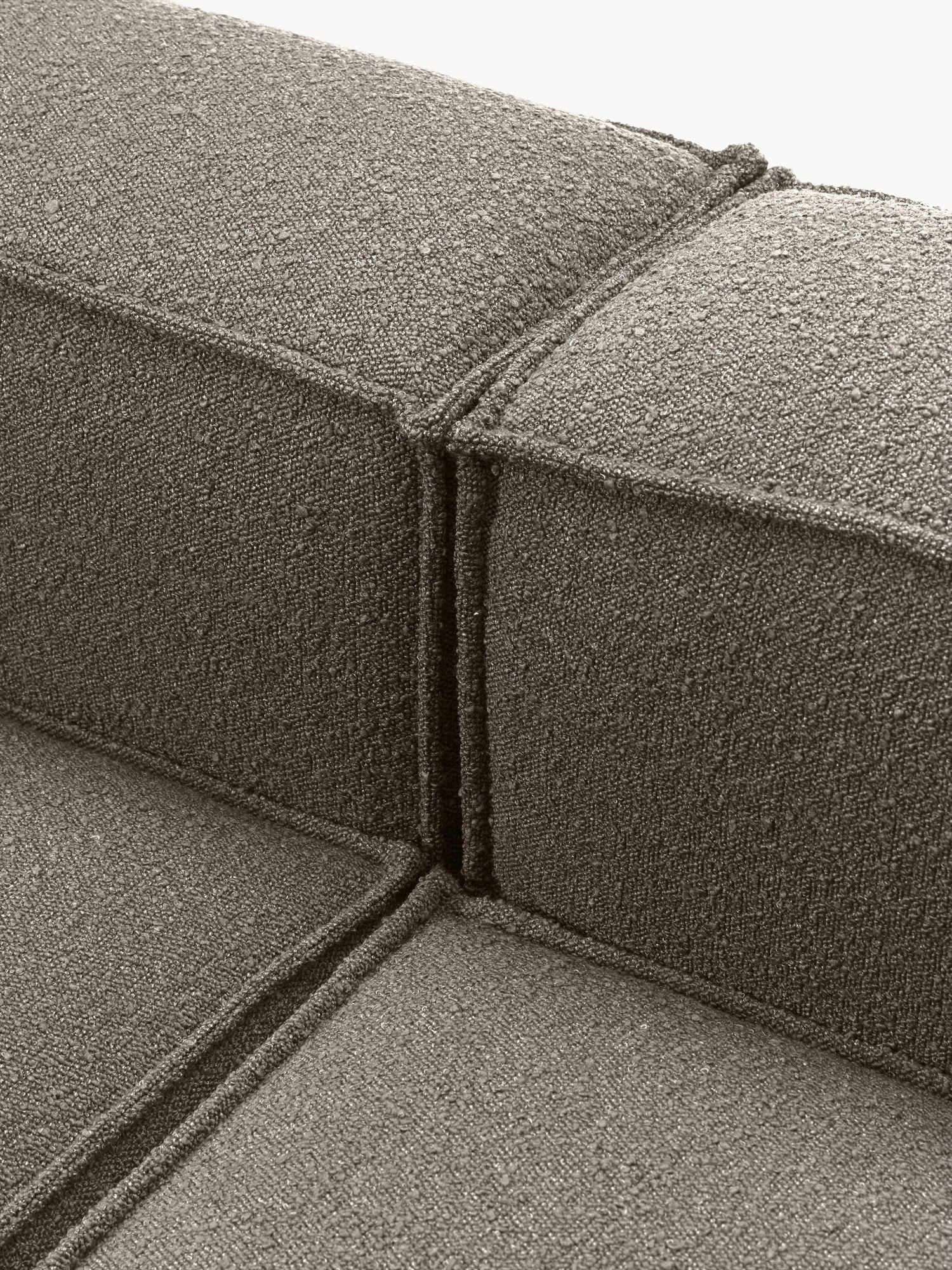 Canapé modulable 4 places en tissu bouclé avec pouf Frida