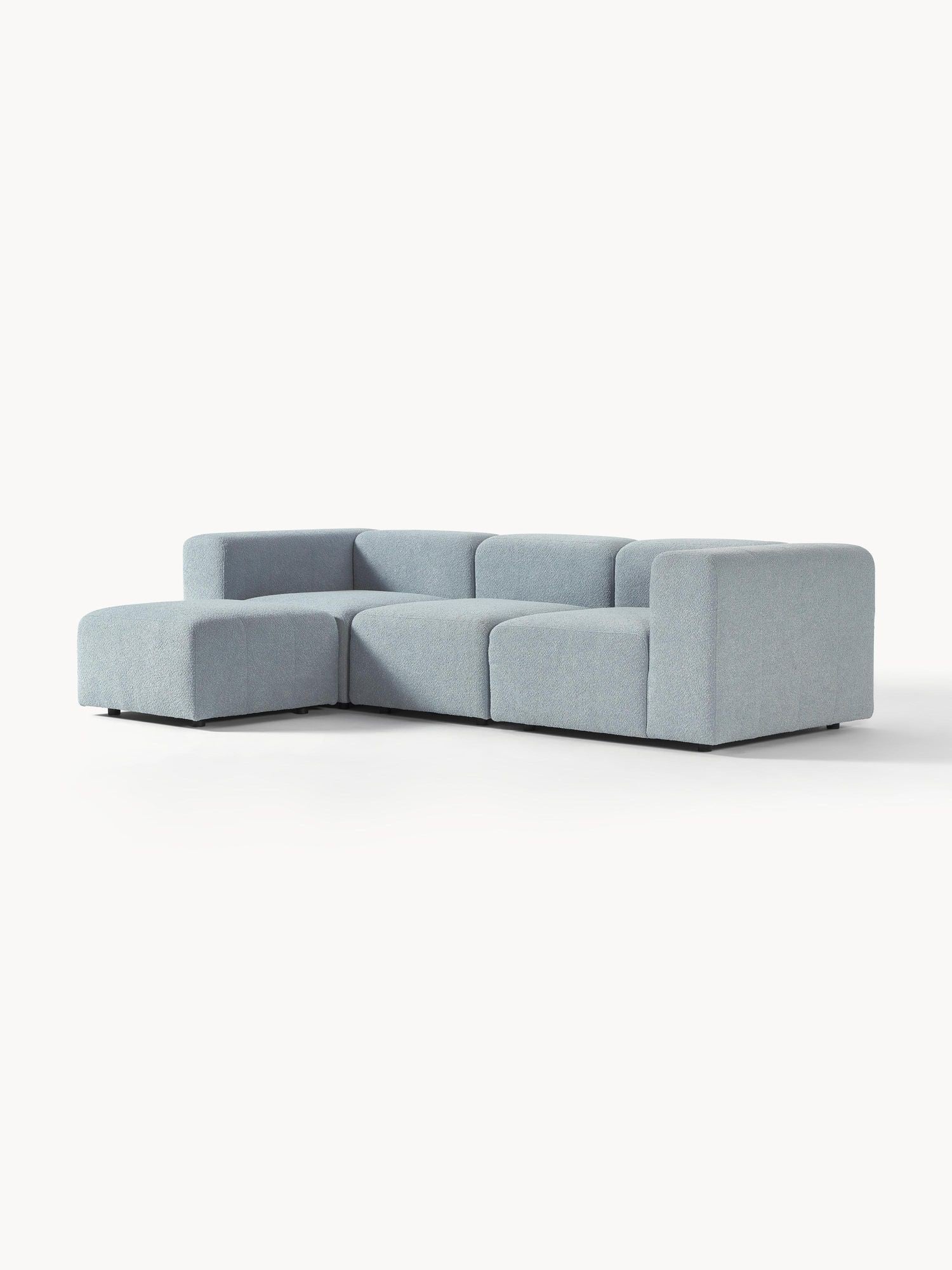 Canapé modulable 4 places en tissu bouclé avec pouf Pietro