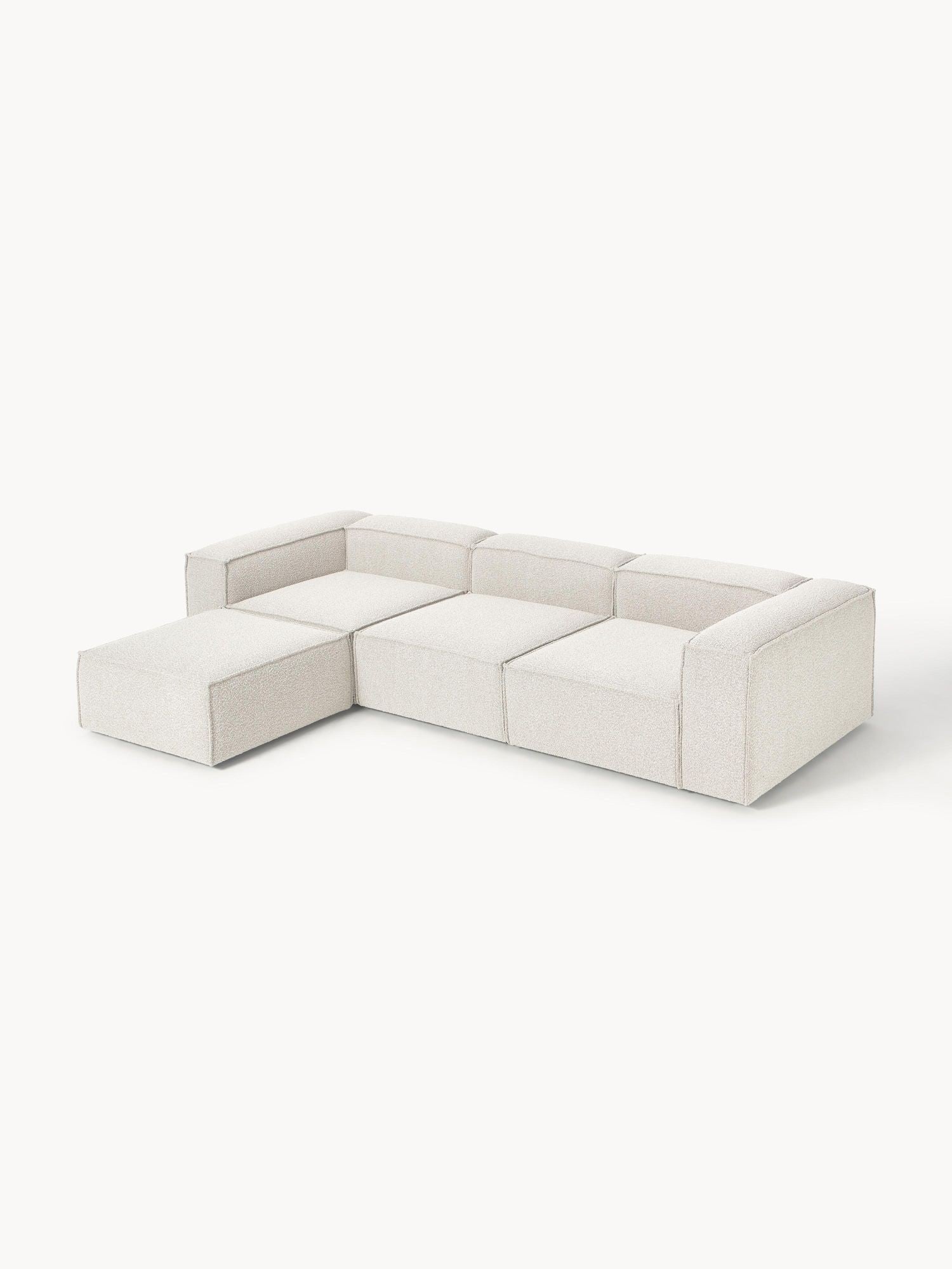Canapé modulable 4 places en tissu bouclé avec pouf Frida