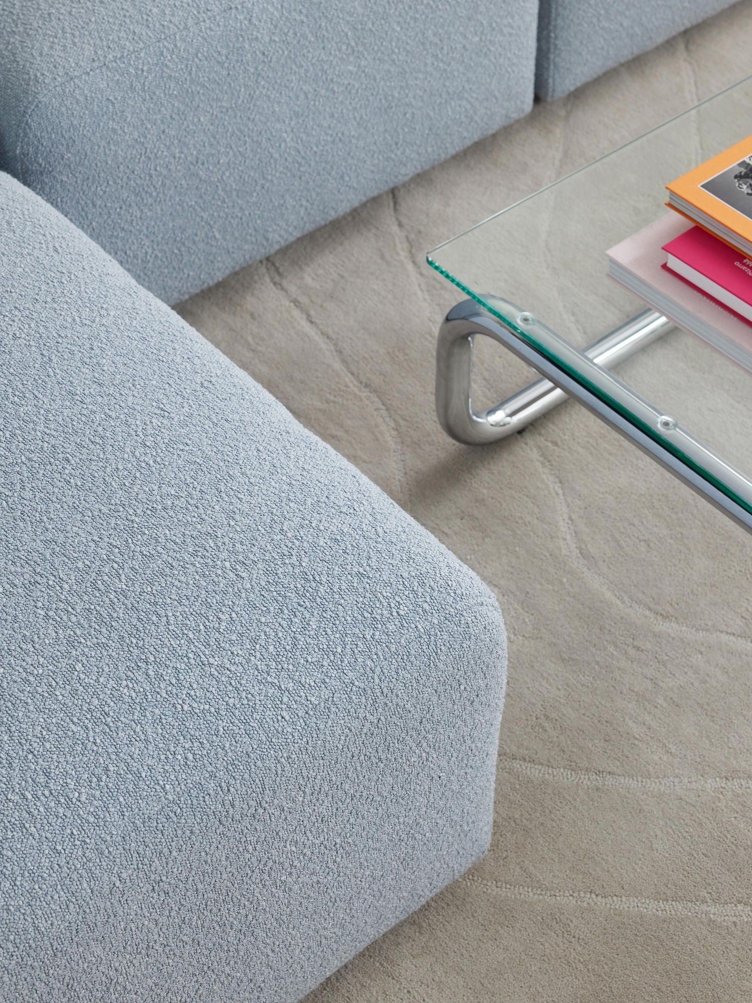 Canapé modulable 4 places en tissu bouclé avec pouf Pietro