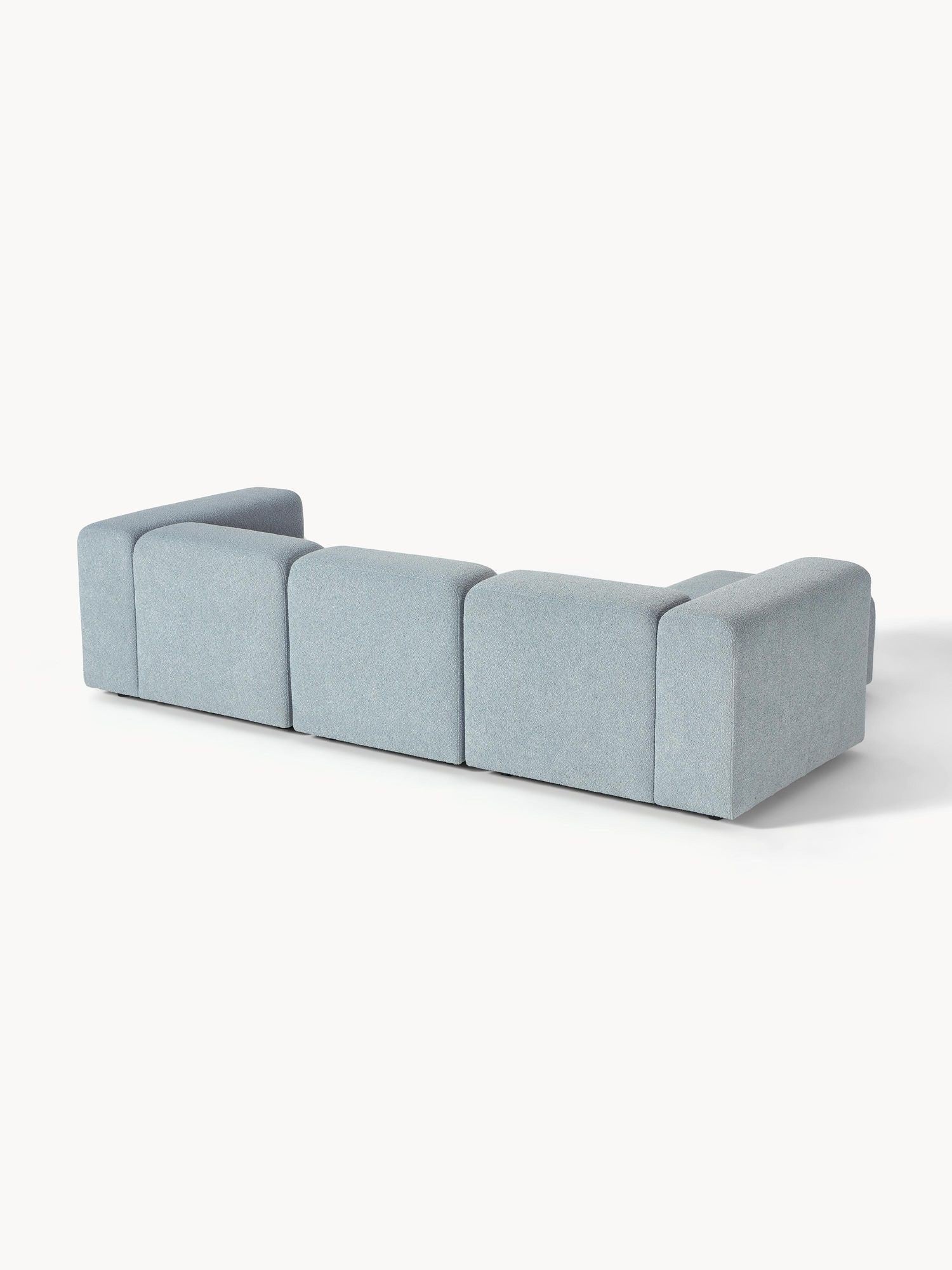 Canapé modulable 4 places en tissu bouclé avec pouf Pietro