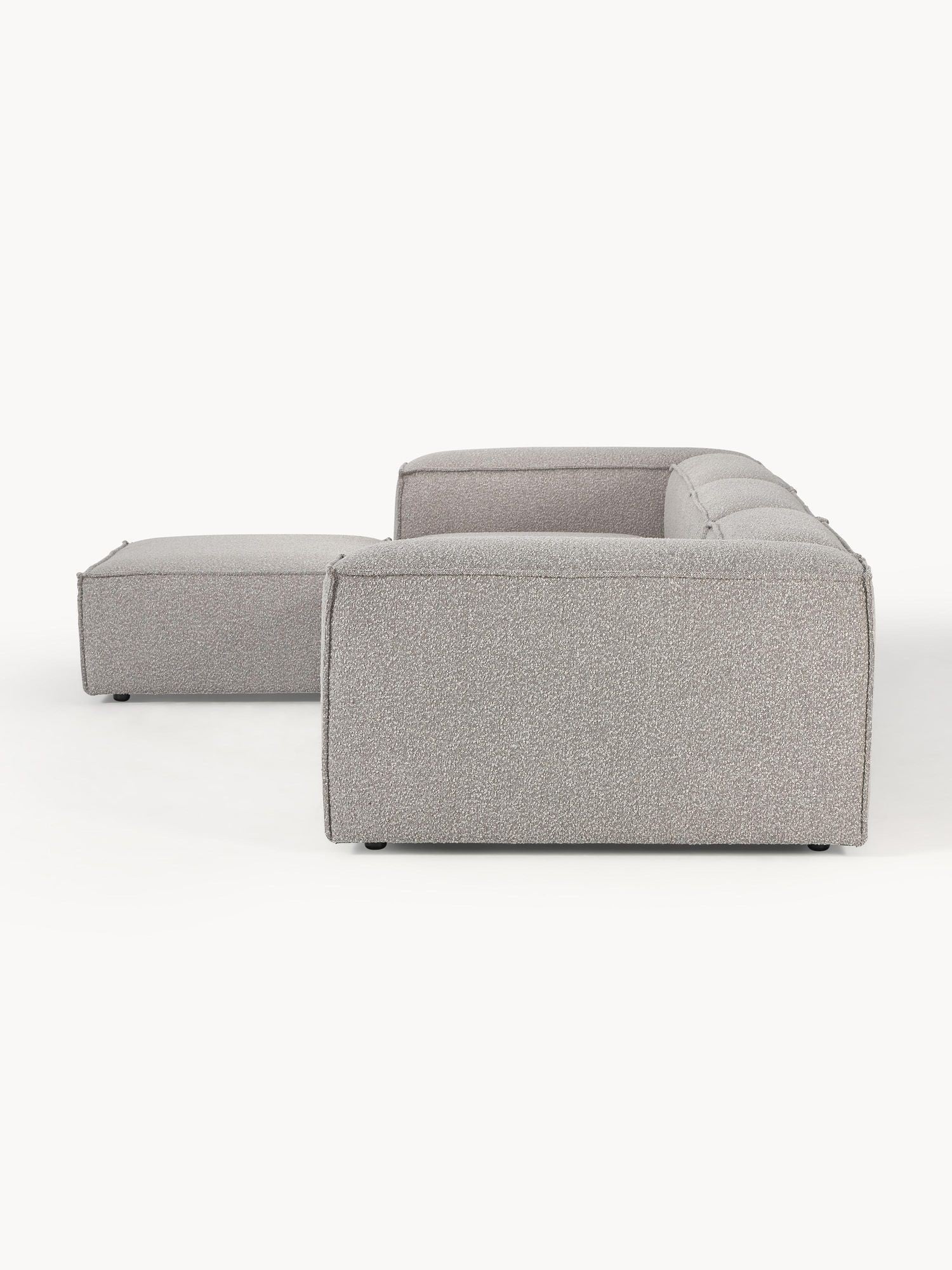 Canapé modulable 4 places en tissu bouclé avec pouf Frida