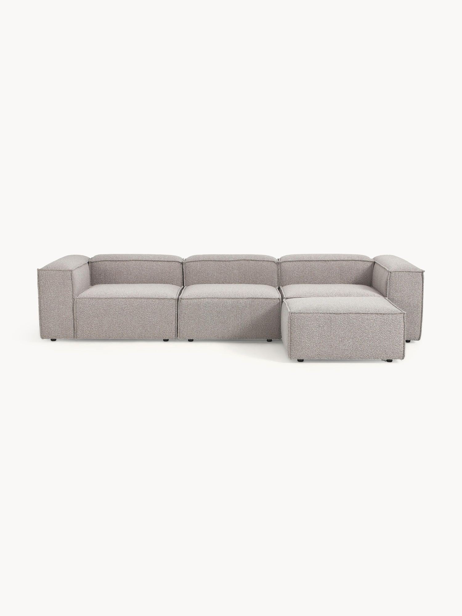 Canapé modulable 4 places en tissu bouclé avec pouf Frida