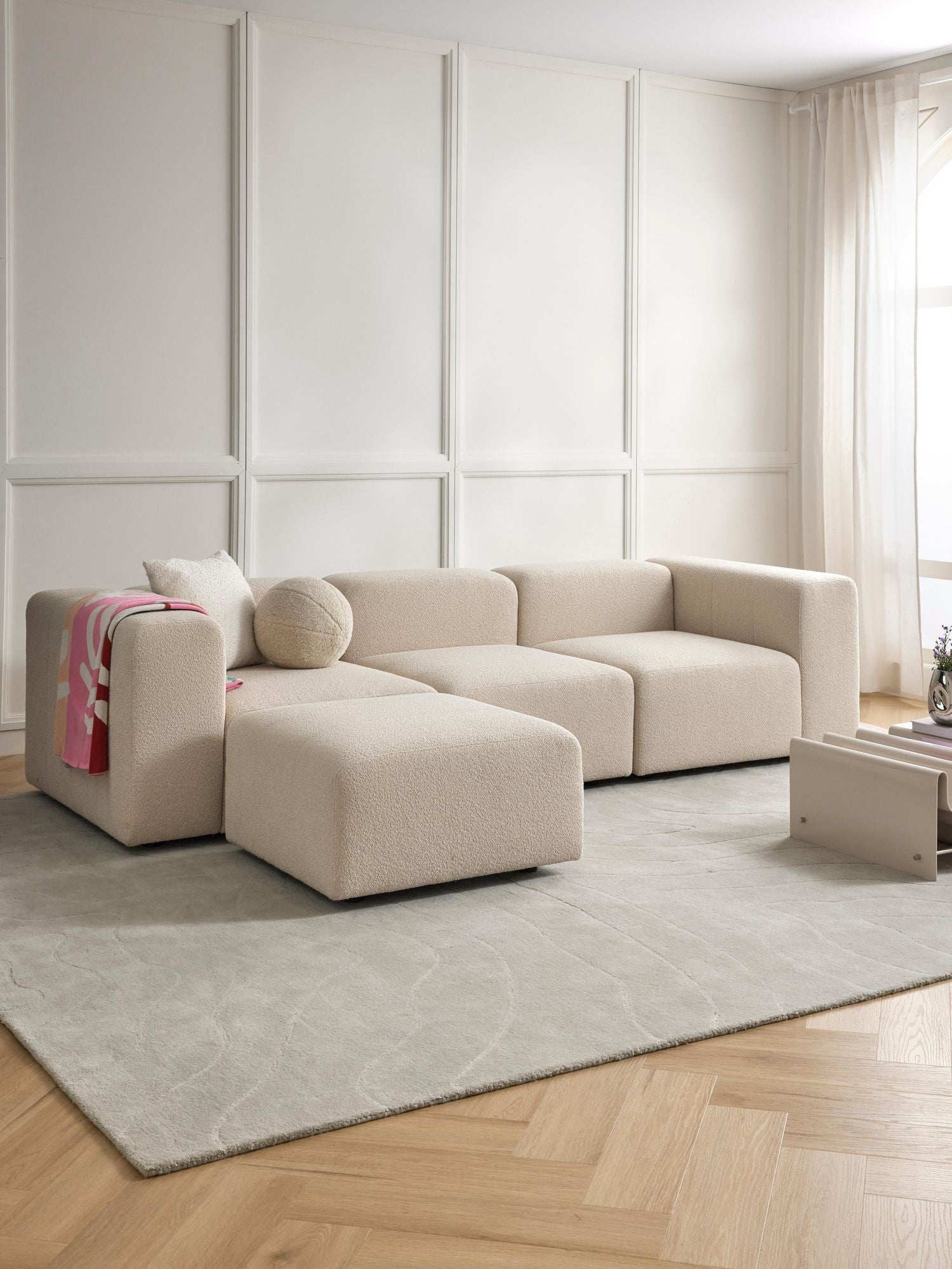 Canapé modulable 4 places en tissu bouclé avec pouf Pietro