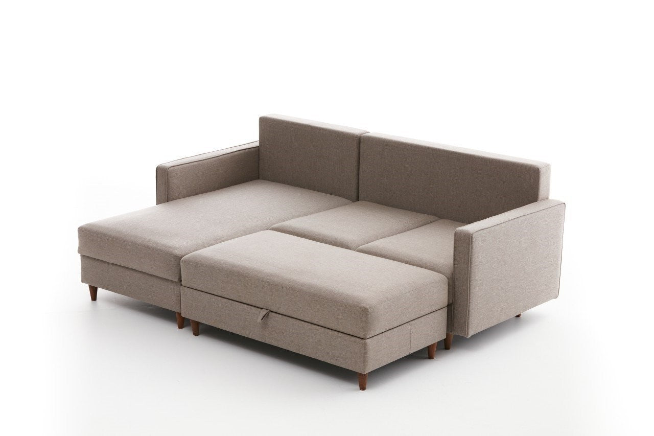 Canapé d'angle à gauche convertible avec pouf-coffre Evania Tissu Taupe