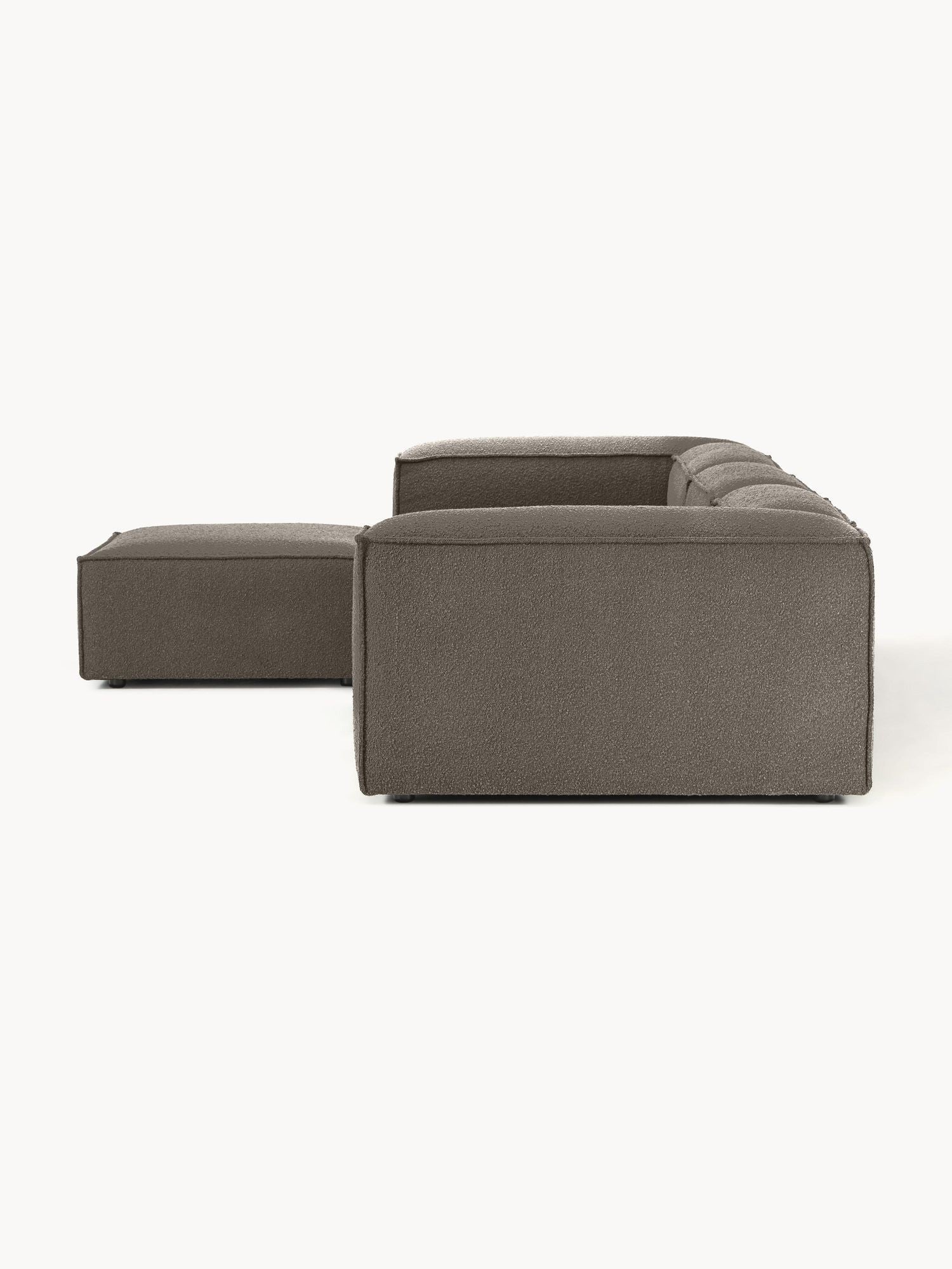 Canapé modulable 4 places en tissu bouclé avec pouf Frida