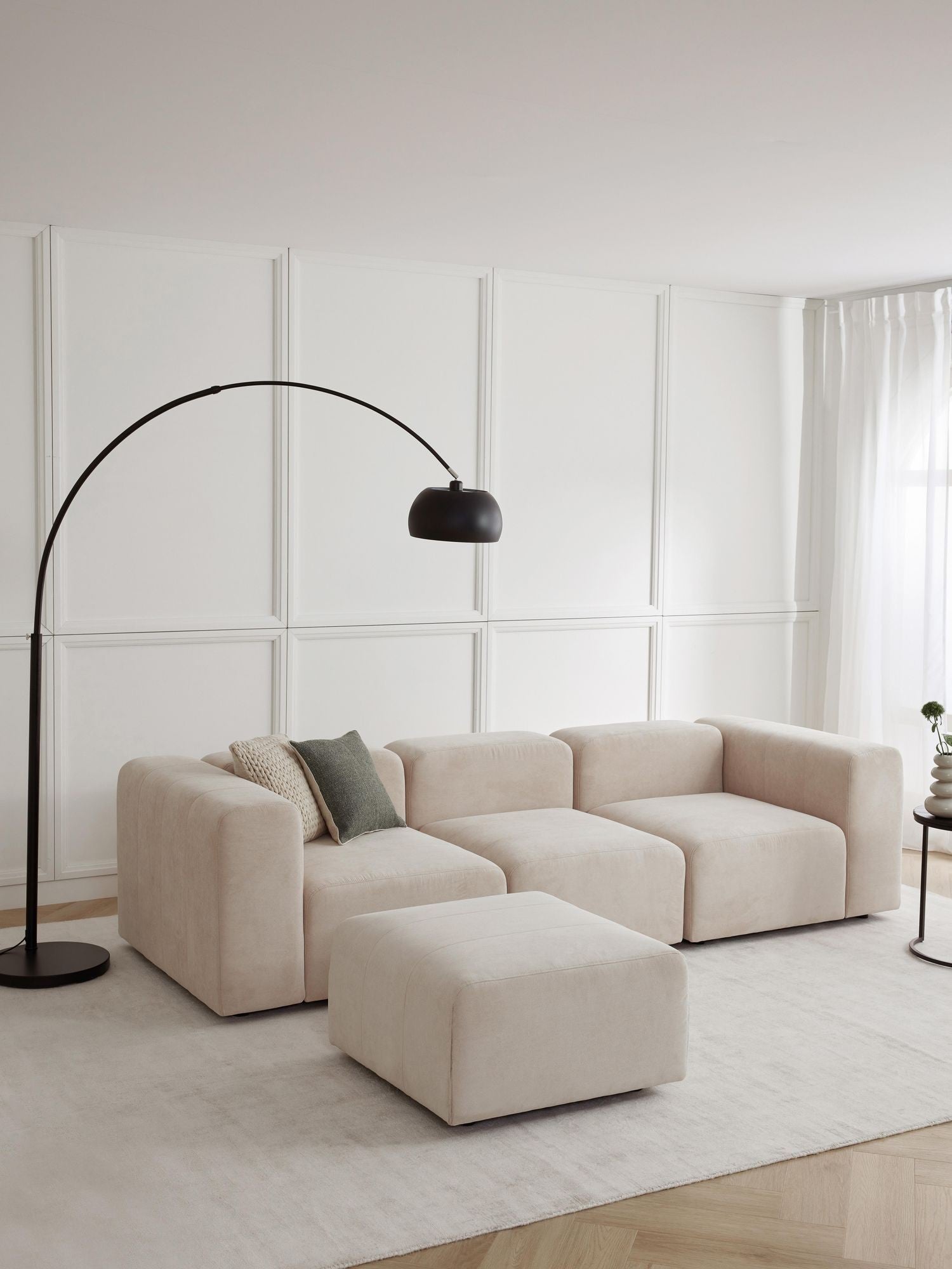 Canapé modulable 4 places en tissu avec pouf Pietro