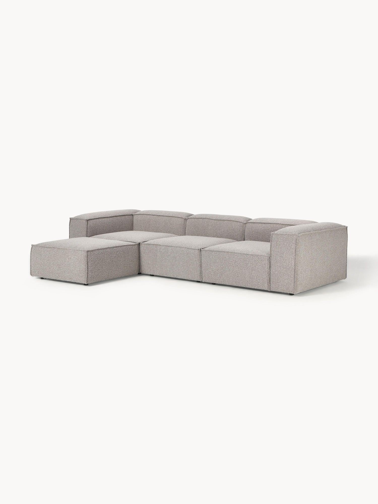 Canapé modulable 4 places en tissu bouclé avec pouf Frida