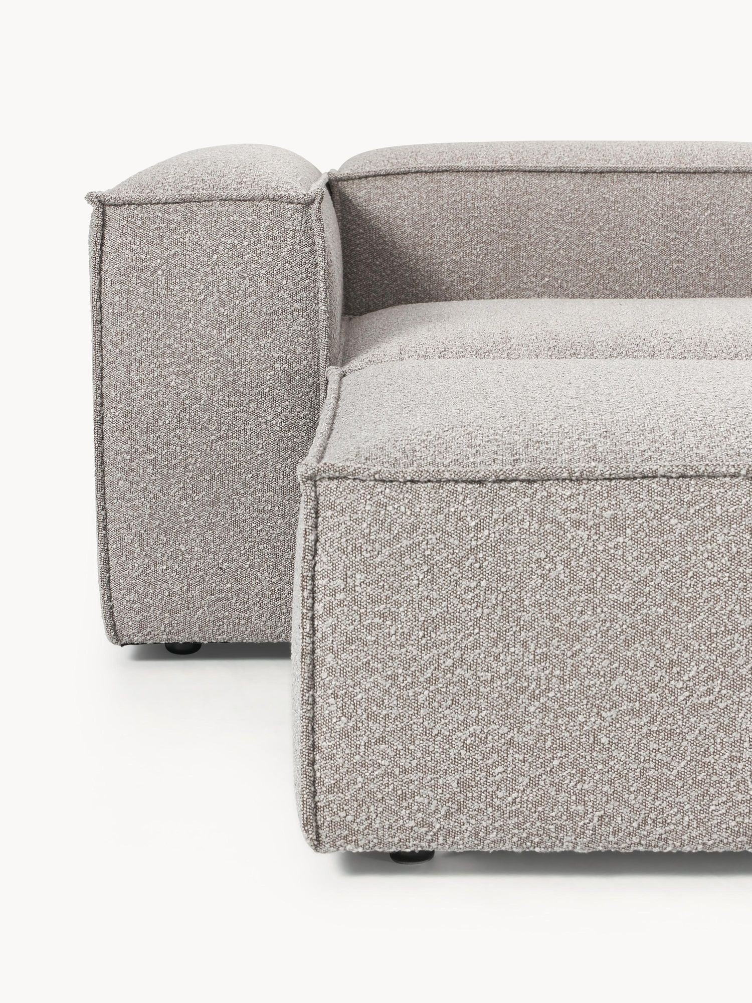 Canapé modulable 4 places en tissu bouclé avec pouf Frida