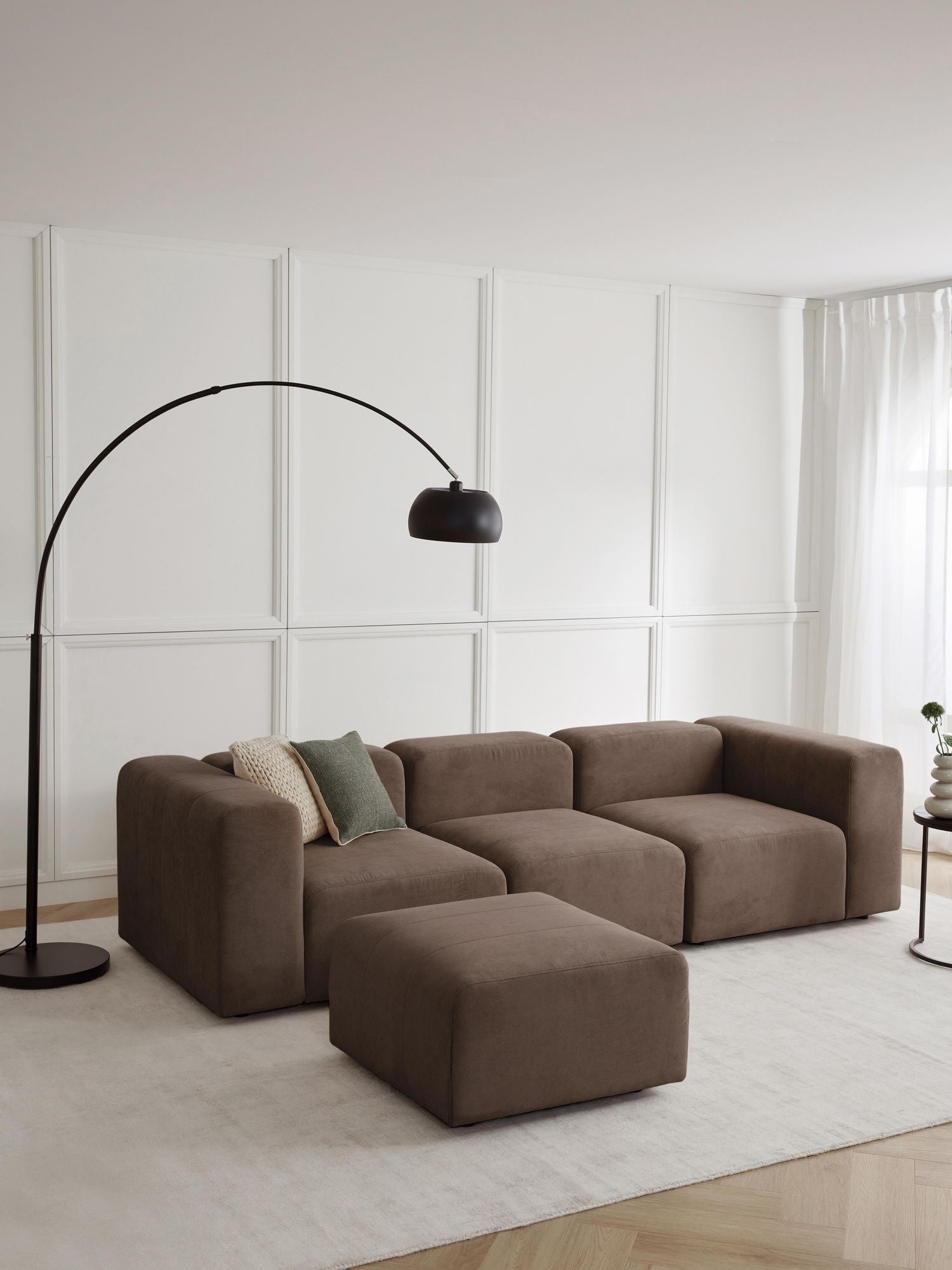 Canapé modulable 4 places en tissu avec pouf Pietro